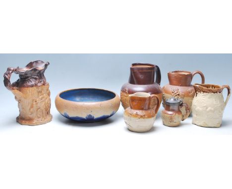 A collection of 19th century Doulton Lambeth stoneware jugs having raised tavern and hunting scenes decoration with salt glaz