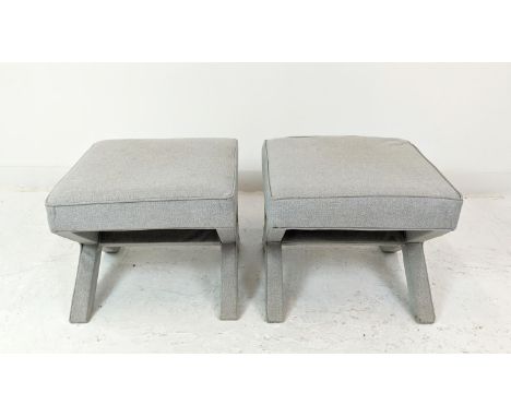 EICHHOLTZ FOOTSTOOLS, a pair, light grey upholstery on x-frame supports, 56cm W x 56cm D x 47cm H. (2) 