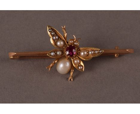A late Victorian 15ct gold and pearl insect brooch, the bar supporting a bee set with a pearl and seed pearls and centred wit