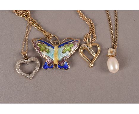 A group of four pendants on chains, two being heart shaped set with clear stones, one an enamelled butterfly, some chips, and