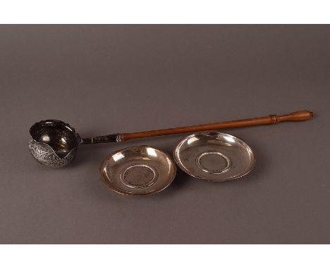 A Georgian silver toddy ladle, having embossed cup with spout and inset 1732 George II coin, repaired, with turned wooden han