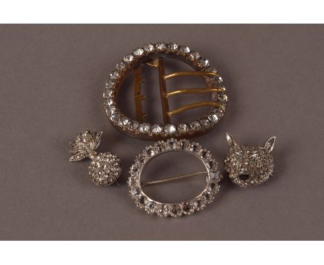 Three vintage paste set brooches and a belt buckle, including a Royal Fusiliers sweetheart brooch, a fox mask example, an ova