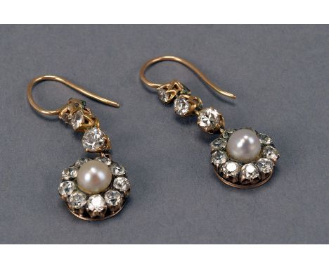 A pretty pair of diamond and pearl cluster pendant earrings, having drop of circular cluster of old cuts centred by a white p