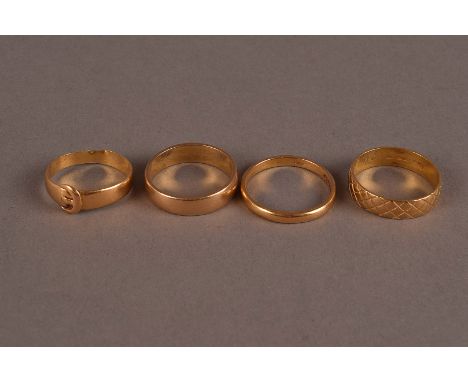 A group of four vintage and modern 22ct gold wedding bands, including two plain examples, one in the form of a belt and one w