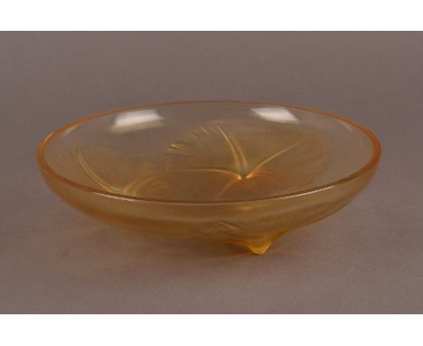 A Lalique amber glass bowl, ‘Volubilis’ design c.1921, wheel engraved R. Lalique France No. 383, with three moulded opalescen