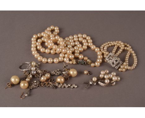 A small group of Art Deco and later jewellery, including a silver and pearl brooch, a Chinese white metal and pearl dress rin