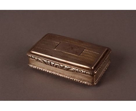 A George IV silver snuff box by John Shaw, rectangular with engraved lines to lid and base, with chased foliage to rims, Birm