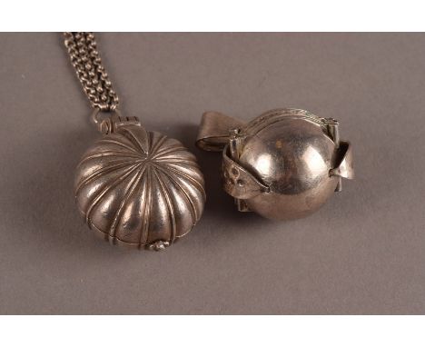 An interesting vintage silver vinaigrette style pendant on chain, the round shaped pendant hinged to reveal pierced hinged gr