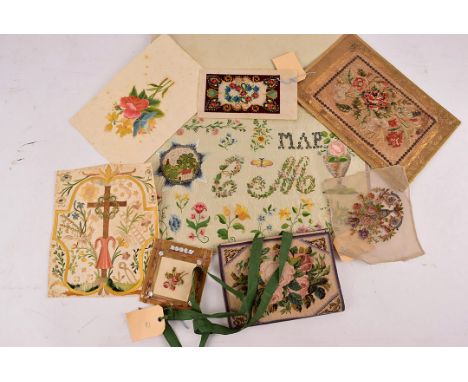 A collection of 19th century continental embroideries, including a colifichet of the crucifix after the resurrection on paper