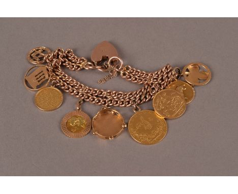 A 9ct gold charm bracelet, the double strand of curb link chain, probably once a watch chain, mounted with a George V half so