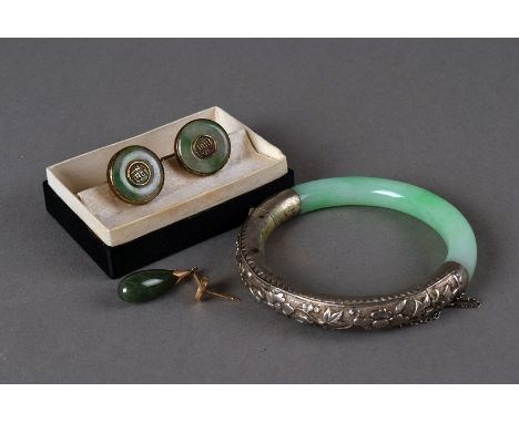 A vintage Chinese white metal and hardstone bangle, the light green jade style curved section with collar and hinged section,