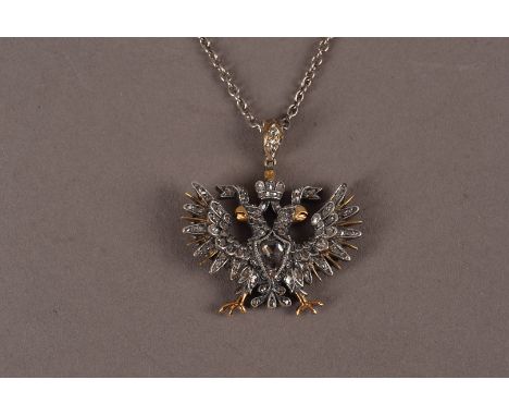 A fine late 19th century Russian gold and diamond pendant, modelled in white and yellow metal as a double headed eagle and se