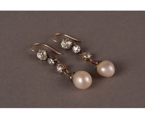 A pair of antique certified natural pearl and diamond drop pendant earrings, each of the oval shaped white natural saltwater 