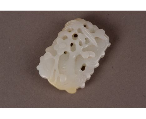 A Chinese celadon jade pendant, decorated in relief caved pine trees to one side, and prunus blossom verso 5cm HThere are no 
