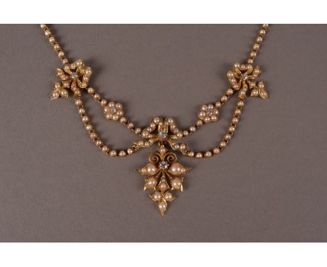 A late Victorian or Edwardian 15ct gold and pearl fringe necklace, the chain and box clasp all set with seed pearls and havin