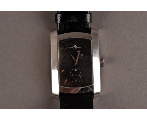 A modern 18ct white gold cased Baume & Mercier gentleman’s wristwatch, the rectangular case with black dial, having two subsi