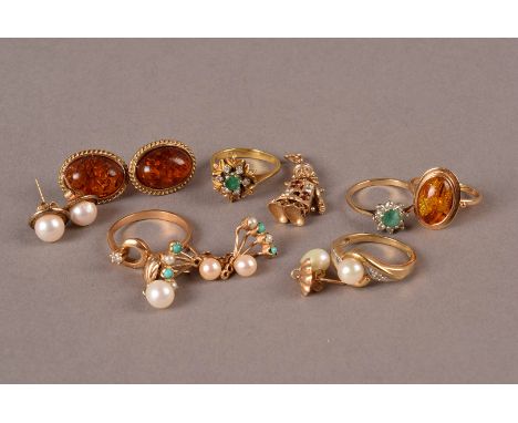 A small group of 9ct gold and other jewellery, including a Middle Eastern amber ring and earrings, three pairs of pearl set e