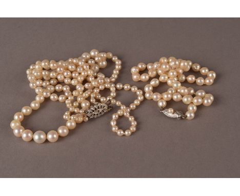 Two vintage cultured pearl necklaces, one being a two stranded example with white 9ct gold clasp, the other a single strand w