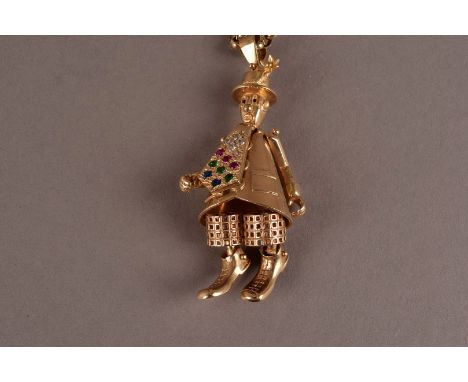A modern 9ct gold and gem set clown pendant on chain, the reticulated funny man in hat and kipper tie set with precious stone