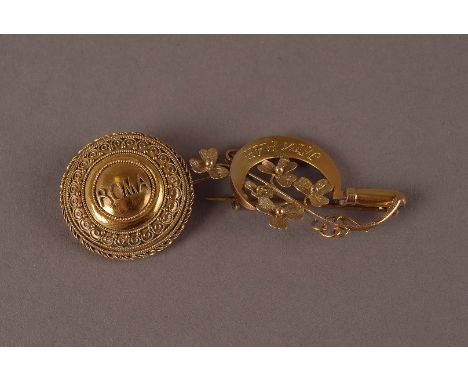 Two vintage gold brooches, one being a shield shape marked ROMA, the other in 9ct gold modelled as a sickle with flowers mark