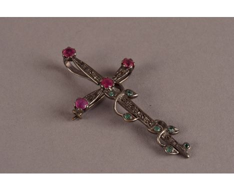 A vintage white metal and gem set brooch cum pendant, in the form of sword and set with garnets in red and green
