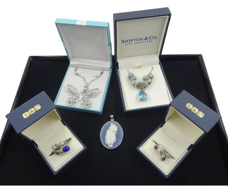 Collection of silver jewellery including butterfly pendant necklace, blue and white agate cat pendant, topaz and opal necklac