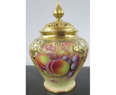 A Royal Worcester covered pot pourri, decorated to the front with fruit to a mossy background by M Morris, shape number H279,