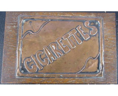 An oak rectangular box, the lid with embossed copper panel, Cigarettes, 7ins x 4.5ins, height 1.5ins,