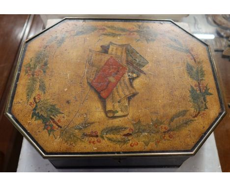 A 19th century Regency octagonal ebonised work box, the lid painted with a central panel of sheet music etc surrounded by a b