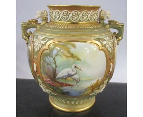 A Royal Worcester quarter lobed vase, decorated with storks wading birds in two panels and landscape in the other two panels 