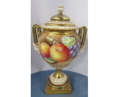 A Royal Worcester covered vase, having twin mask handles, decorated with fruit to a mossy ground by Leaman, shape number 2363