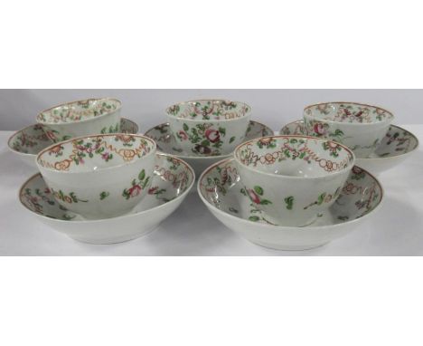 Five 19th century English porcelain tea bowls and saucers, decorated with flowers and swags