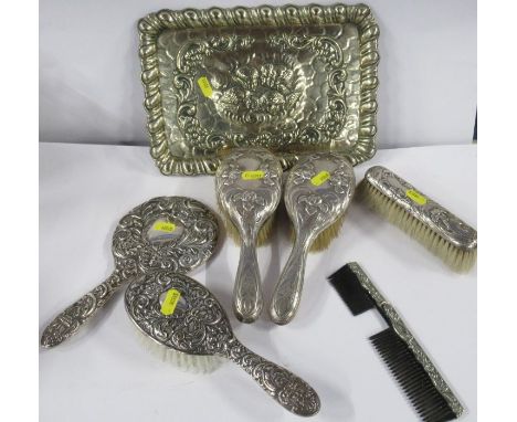 A collection of hallmarked silver dressing table brushes, hand mirror and comb, together with a silver plated rectangular tra