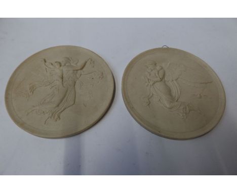 Two Royal Copenhagen white porcelain plaques, decorated with neo classical figures, diameter 6ins