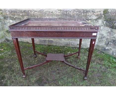 A Georgian design silver table, with arched pierced gallery, af, fluted frieze and raised on four square tapestry legs, unite