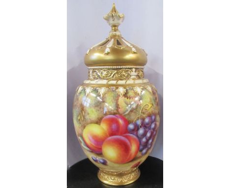 A Royal Worcester crown top pot pourri vase, with inner and outer cover, painted all round with fruit to a mossy ground, by H