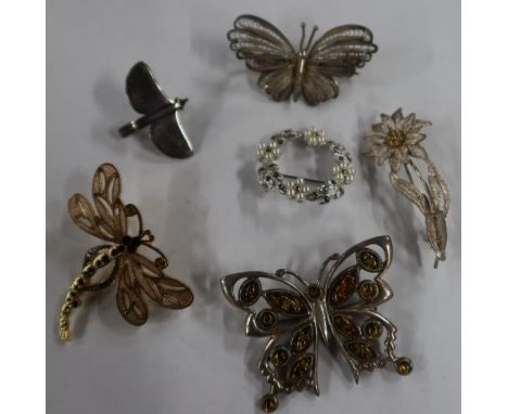 A Orla Gorie silver stylisled bird brooch, signed OMG, together with a white metal openwork butterfly brooch set amber,&nbsp;