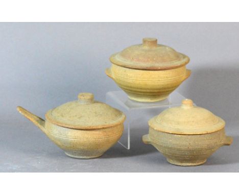 Leach Pottery; three stoneware soup bowls and covers, brown and green glazes to insides, impressed pottery marks, largest dia