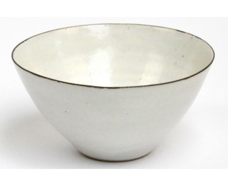 LUCIE RIE (1902-1995); a stoneware bowl covered in off white glaze with manganese rim, impressed LR mark, made c.1957, diamet