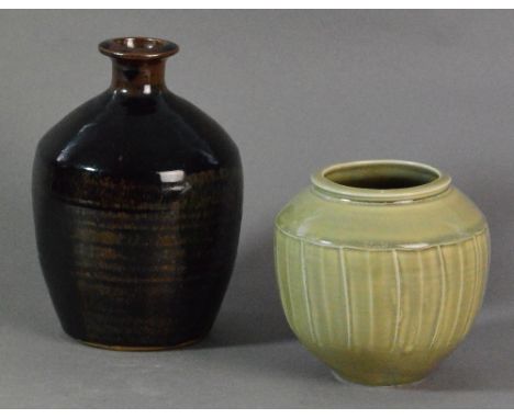 DAVID LEACH (1911-2005) for Lowerdown Pottery; a fluted porcelain jar covered in green celadon glaze and a stoneware bottle c
