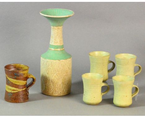 Winchcombe Pottery: four small stoneware mugs, a Jane Hamlyn mug and a vase marked JR, tallest height 24cm (6). CONDITION REP