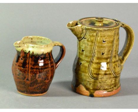 JIM MALONE (born 1946); a stoneware coffee pot with incised decoration and covered in olive green glaze, and a small stonewar