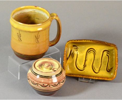 RAY FINCH (1914-2012) for Winchcombe Pottery; an early slipware tankard, impressed RF/WP combined mark, a slipware butter dis