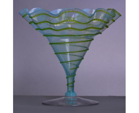 JAMES POWELL WHITEFRIARS; a blue opal flared vase with applied lime green spiral trail decoration, the shaped rim above taper