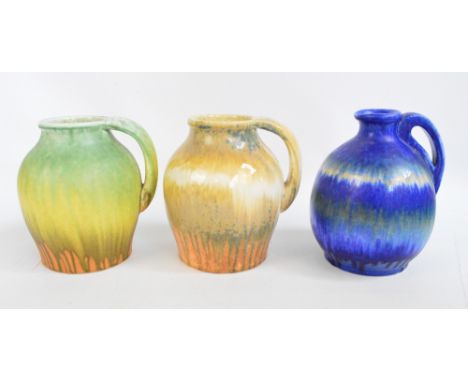 Three large Ruskin drizzle glaze decorated jugs with simple loop handles, all three with impressed marks, one with facsimile 