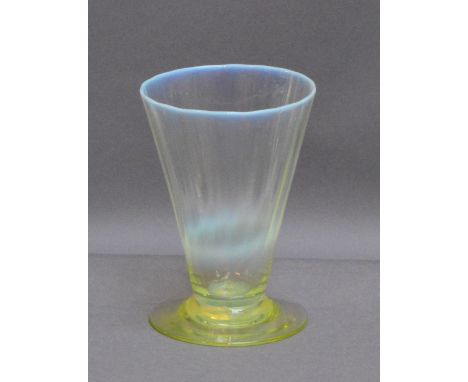 JAMES POWELL WHITEFRIARS; a straw opal beaker with slightly moulded conical bowl above green tinted plain foot, height 10.5cm