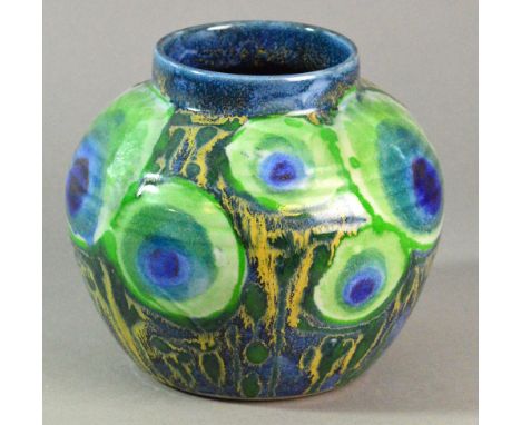 Dartington Pottery; a stoneware vase covered covered in a repeat peacock tail feather motif designed by Clare Woodhall and Ja