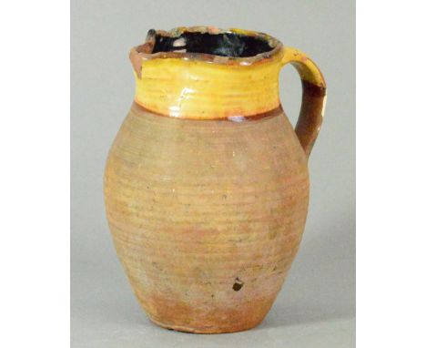 MICHAEL CARDEW (1901-1983) for Winchcombe Pottery; a slipware jug decorated in yellow lead glaze to neck and upper handle, im