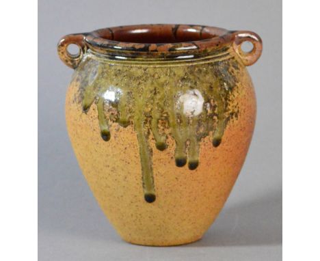 JOHN LEACH (born 1939) for Muchelney Pottery; a stoneware vase with lug handles, green ash running glaze over toasted body, i
