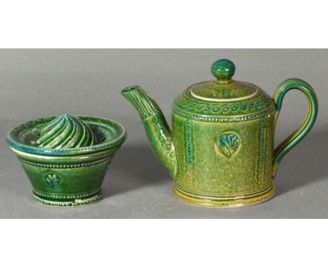 ANDREW YOUNG (born 1949) and JOANNA YOUNG (born 1950); a stoneware teapot and lemon squeezer covered in shiny green glaze, im